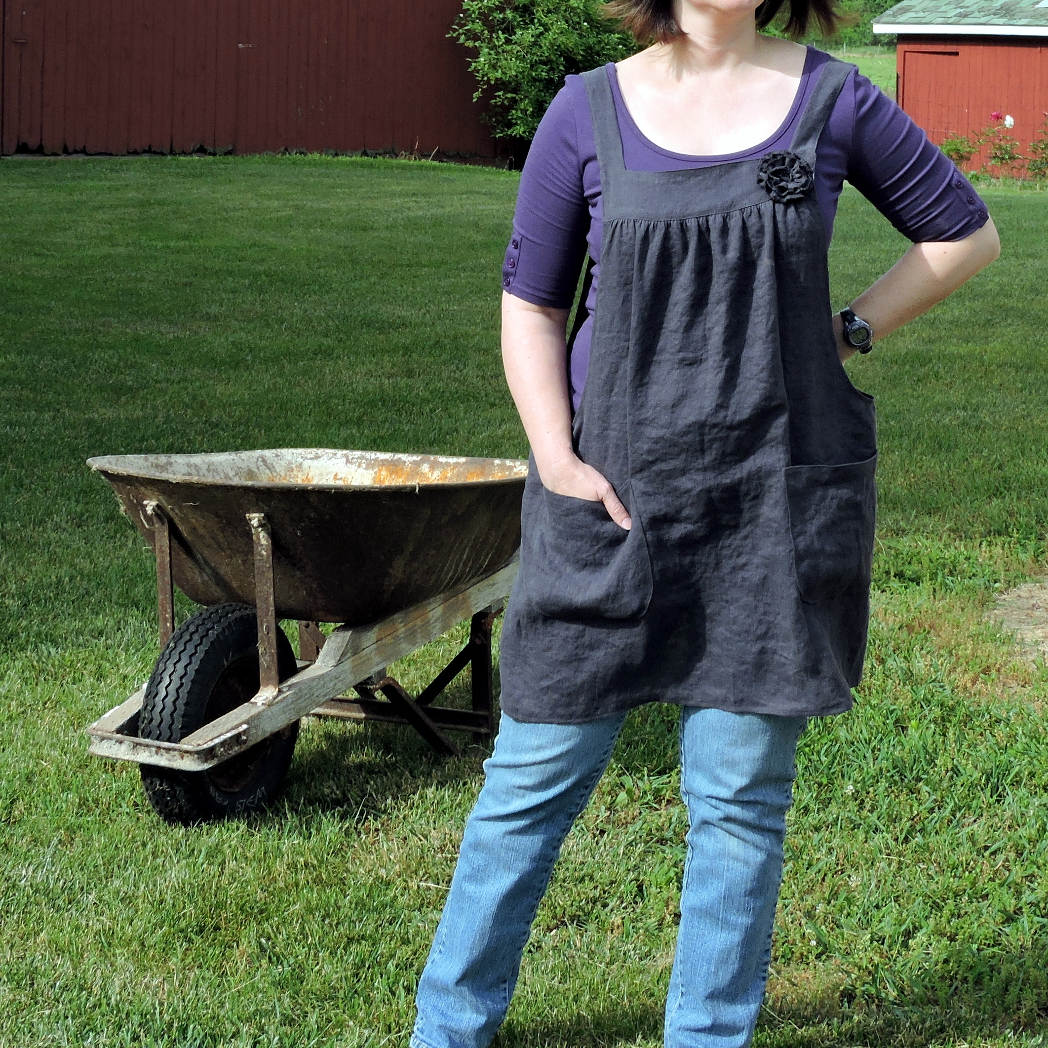 Charcoal Linen Pinafore Apron sewn by Laurie's Gifts worn while gardening