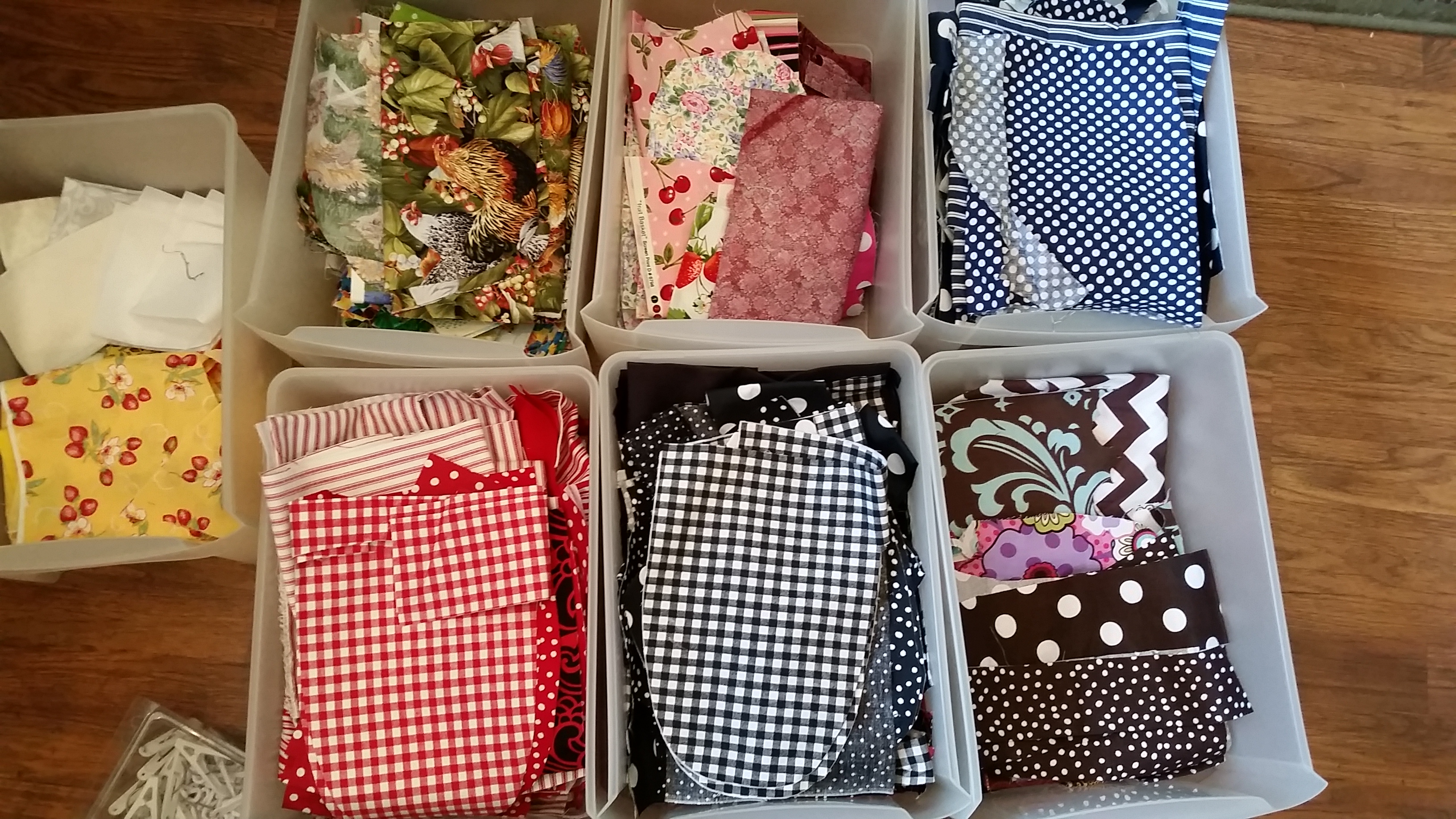 Sorted fabric scraps to create new aprons for Lauries Gifts