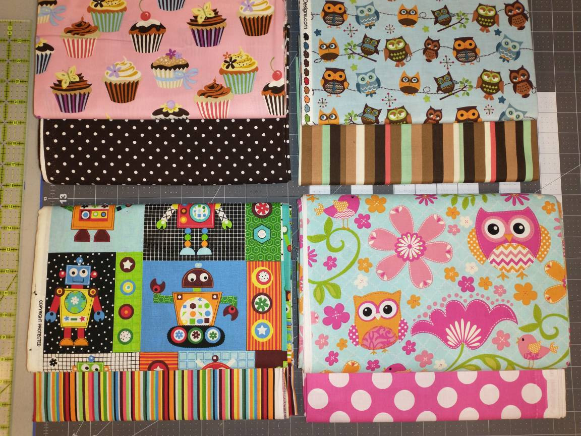 Coordinating cotton quilting fabrics for custom aprons made by Laurie's Gifts