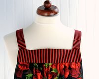 XS-5X Scarlet Poinsettia Pinafore with no ties, relaxed fit smock with pockets, large red poinsettias on black