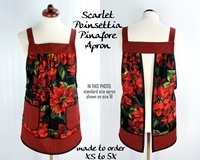 XS-5X Scarlet Poinsettia Pinafore with no ties, relaxed fit smock with pockets, large red poinsettias on black