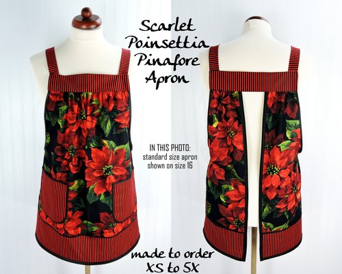 XS-5X Scarlet Poinsettia Pinafore with no ties, relaxed fit smock with pockets, large red poinsettias on black